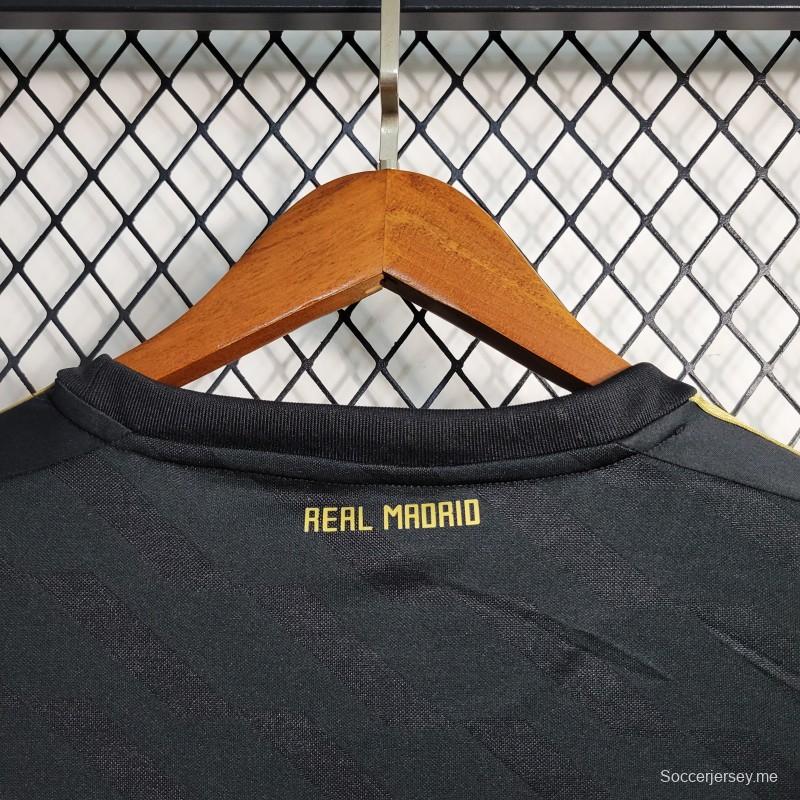 قميص بأكمام طويلة ريترو 2011/12 ريال مدريد ذهاباً وإياباً أسود اللون
