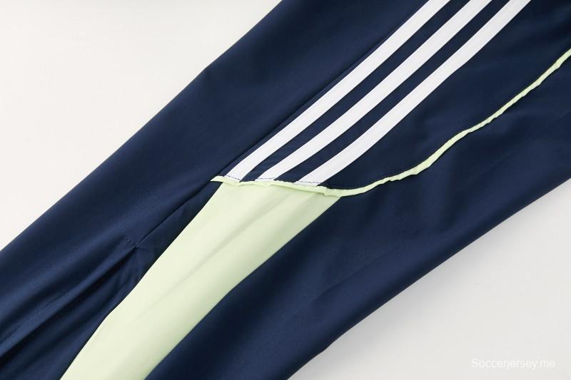 26/27 بدلة رياضية من ريال مدريد باللون الأزرق الداكن مع سترة واقية من الرياح بغطاء للرأس وسحاب كامل + بنطال طويل