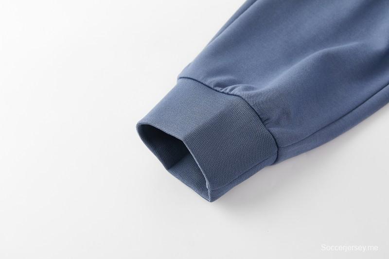 26/27  طقم رياضي من باريس سان جيرمان باللون الأزرق الفولاذي مع سترة بغطاء رأس وسحاب كامل + بنطال طويل