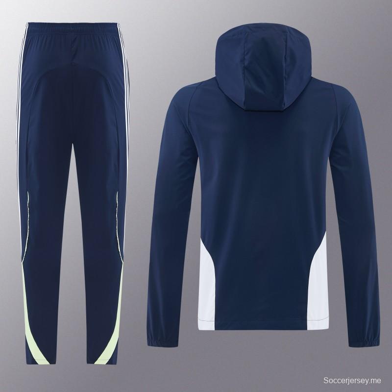 26/27 بدلة رياضية من ريال مدريد باللون الأزرق الداكن مع سترة واقية من الرياح بغطاء للرأس وسحاب كامل + بنطال طويل