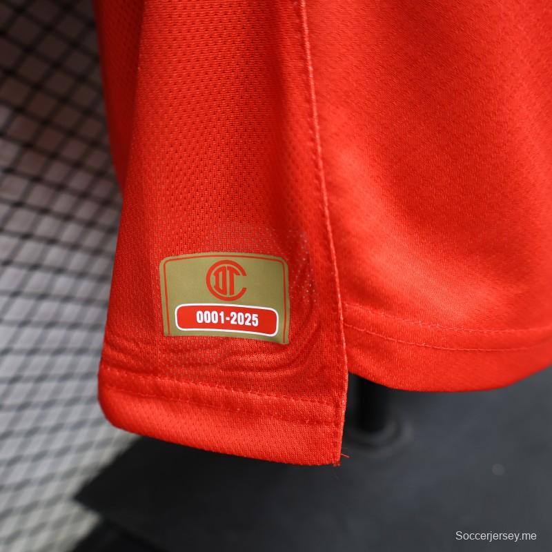 قميص ديارو لفريق ديبورتيفو تولوكا لكرة القدم، إصدار اللاعبين 26/27، باللون الأحمر مع نقشة خطوط دائرية