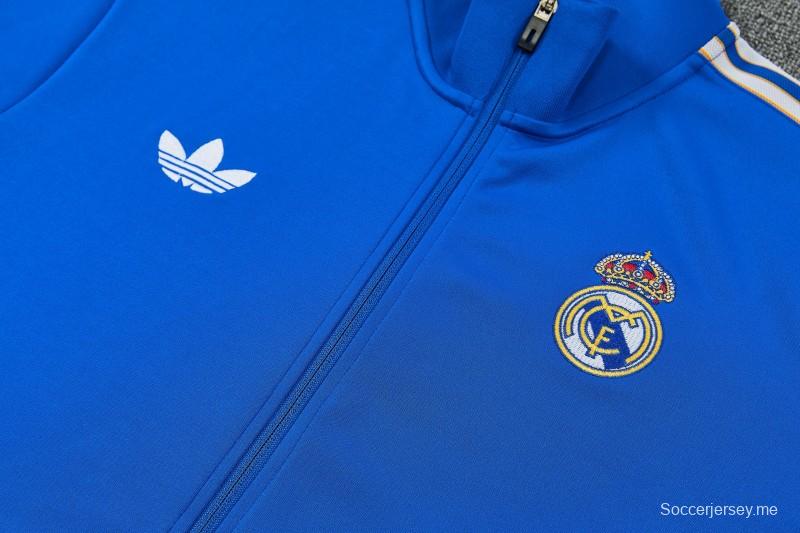 26/27 طقم رياضي من ريال مدريد باللون الأزرق مع سترة بسحاب كامل + بنطال طويل