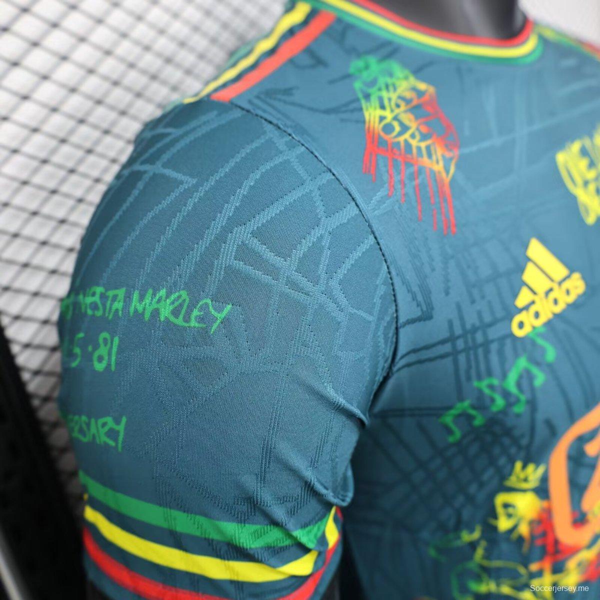 قميص أجاكس 25/26 أزرق داكن مع قميص بوب مارلي التذكاري